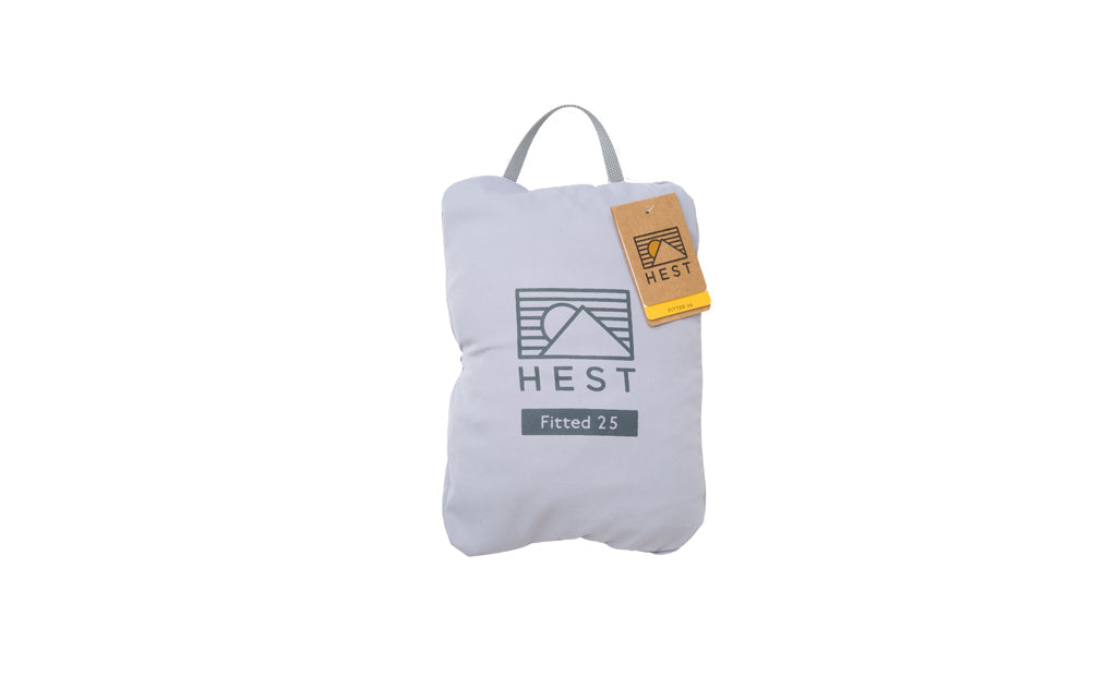 Packed sleeping pad sheets with HEST logo, van conversion bedding set