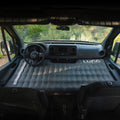 Air pro inflatable mattress fitted to sprinter van front cab seat. Van conversion sleeping solution
