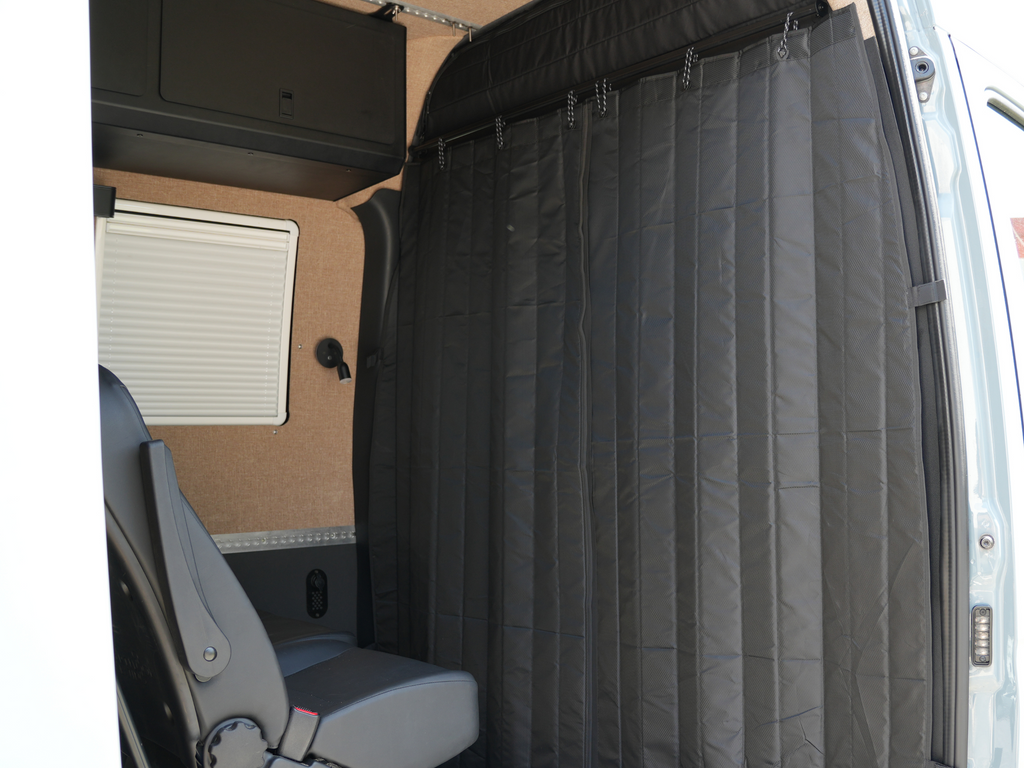 blackout curtain behind driver seat of sprinter van conversion