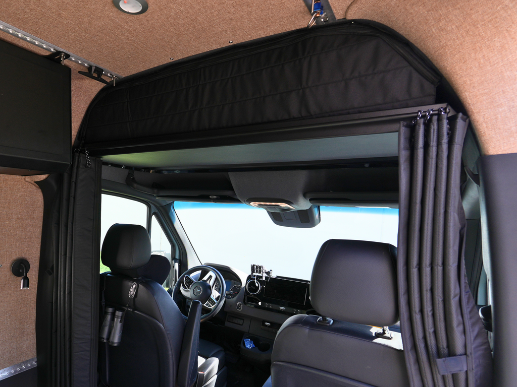 Privacy curtains between front seat of van